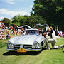 Restored Mercedes-Benz Gullwing being judged at classic car show