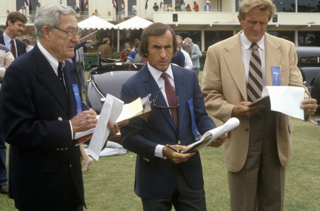 Racing legend Jackie Stewart, center, has been a judge at Pebble Beach. Flanking him here are the late Otis Chandler, left, and Briggs Cunningham.